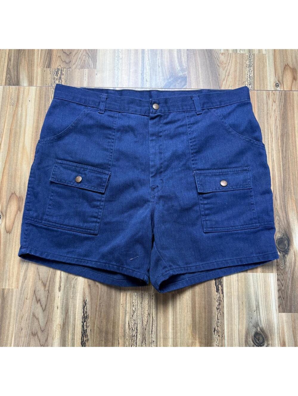 Navy blue denim shorts with button pockets